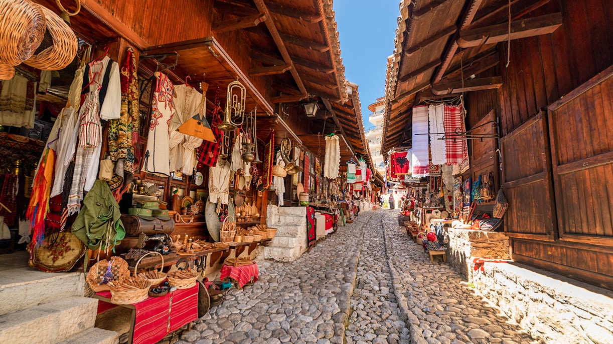 Cobblestone street lined with traditional shops in the Old Bazaar, Kruja.