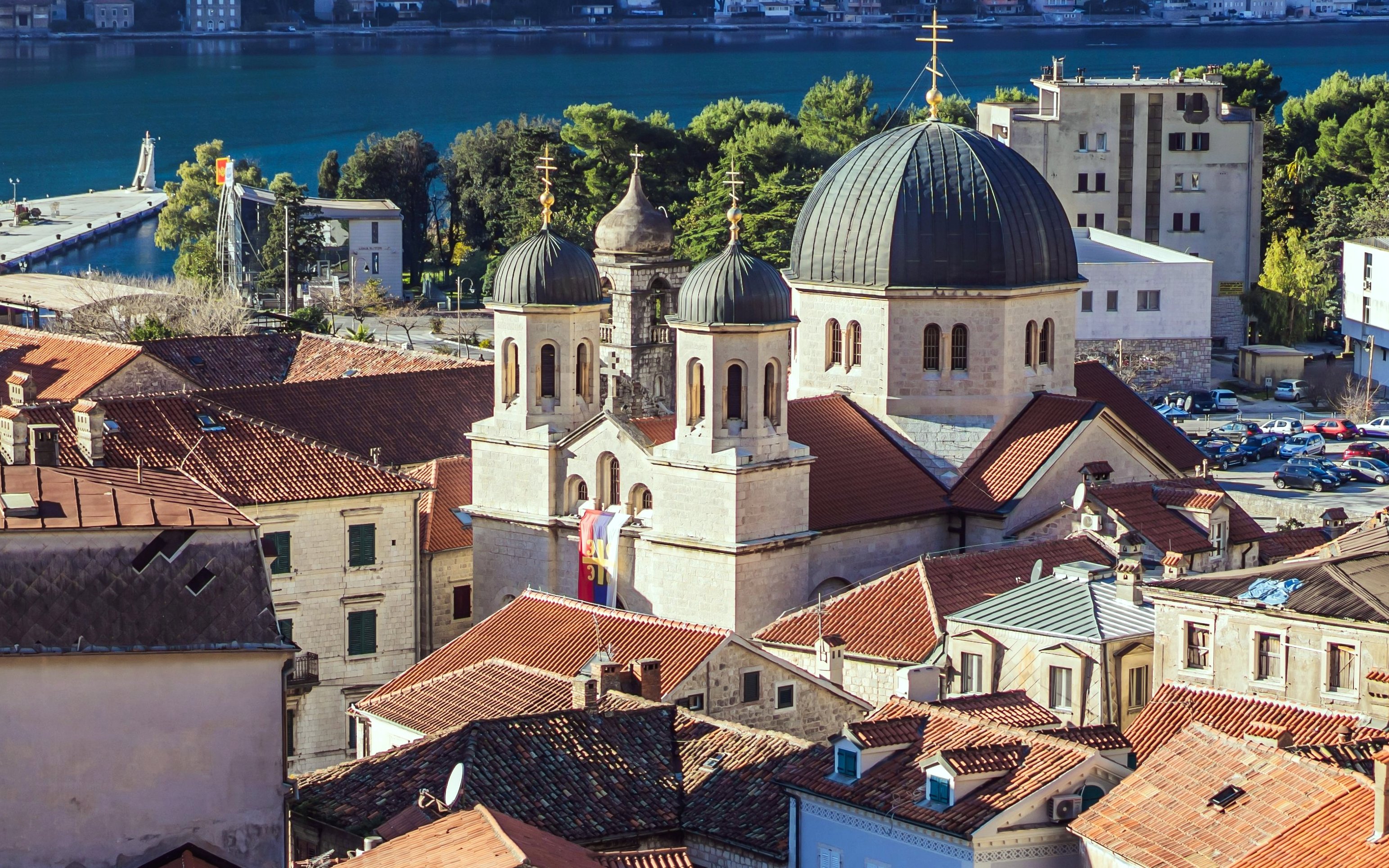 Old Town of Kotor with church domes and red rooftops by the Bay of Kotor, Montenegro.