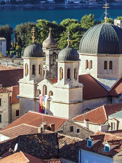 Old Town of Kotor with church domes and red rooftops by the Bay of Kotor, Montenegro.