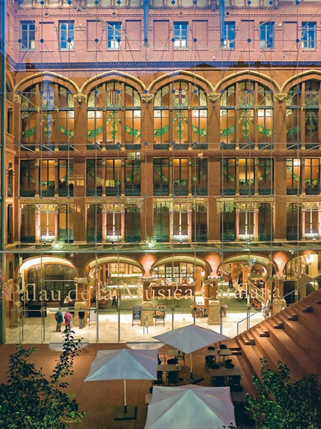 Palau de la Música Catalana entrance with illuminated facade in Barcelona.