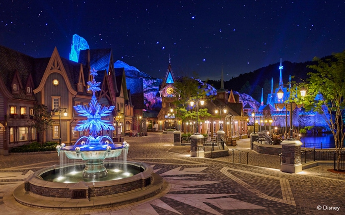 Illuminated Frozen Ever After attraction at night, Disneyland Hong Kong.