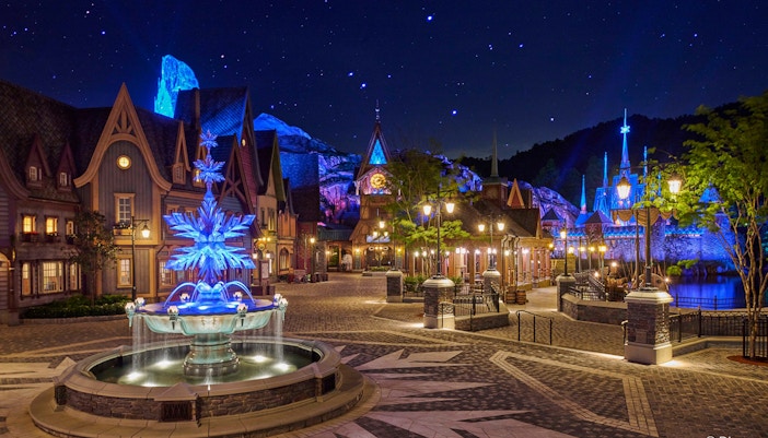 Illuminated Frozen Ever After attraction at night, Disneyland Hong Kong.