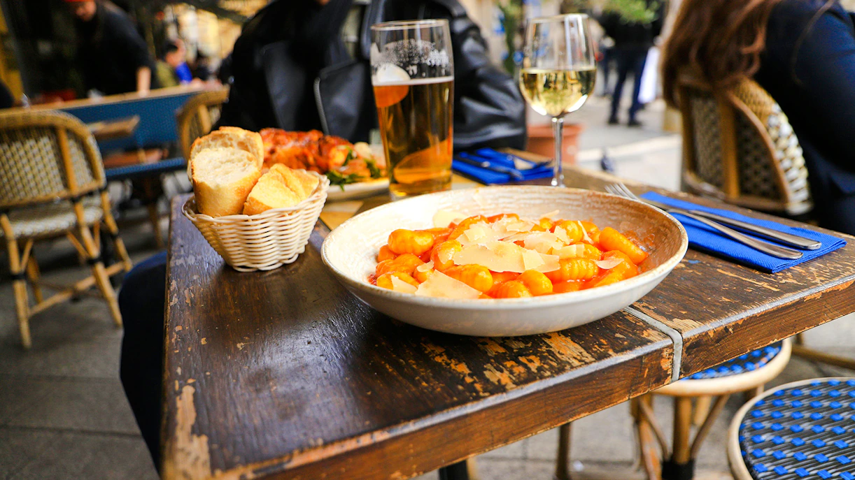Gnocchi and bread on a café table at Place Garibaldi, Nice.