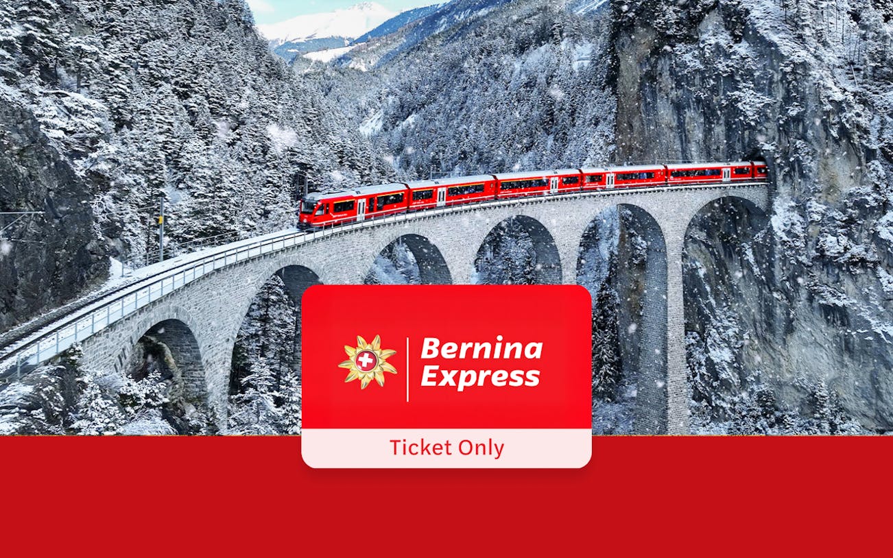 Bernina Express train crossing snowy viaduct in Swiss Alps.