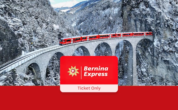 Bernina Express train crossing snowy viaduct in Swiss Alps.