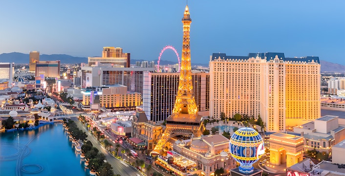 Eiffel Tower replica illuminated at night on Las Vegas Strip, USA.