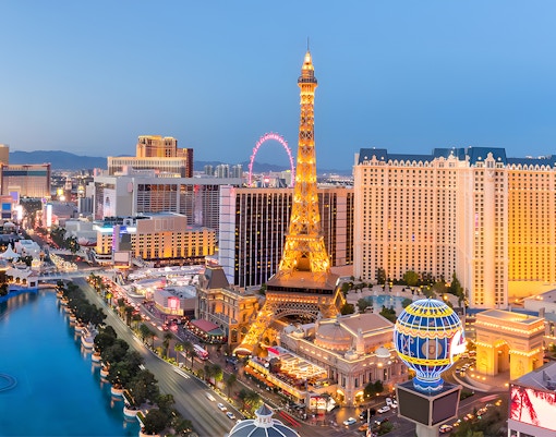 Eiffel Tower replica illuminated at night on Las Vegas Strip, USA.
