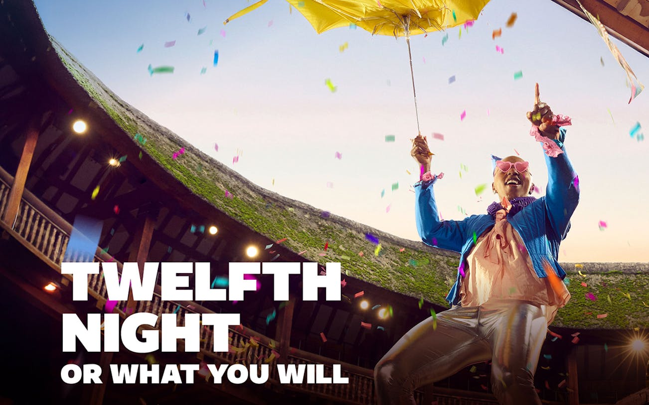 Performer celebrating with confetti at Twelfth Night event in an open-air theater.