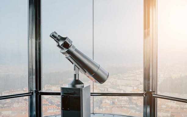 Telescope on observation deck in Zizkov Television Tower, Prague.