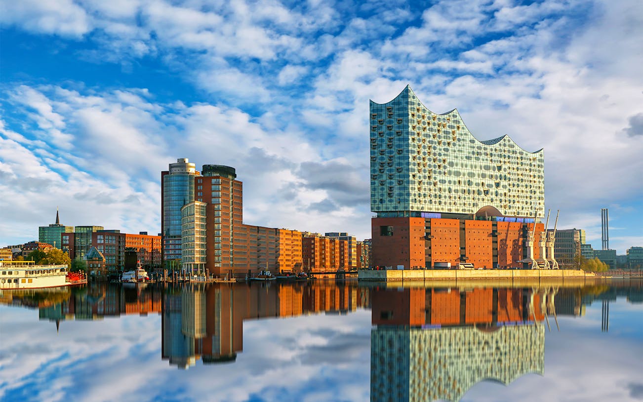 Elbphilharmonie and HafenCity buildings reflecting in water, Hamburg.