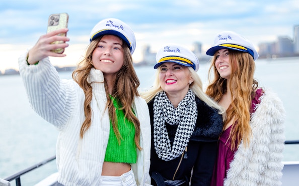 Guests taking a selfie on Lake Michigan dinner cruise.
