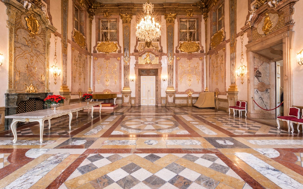 Mirabell Palace concert hall with ornate decor and chandelier in Salzburg.