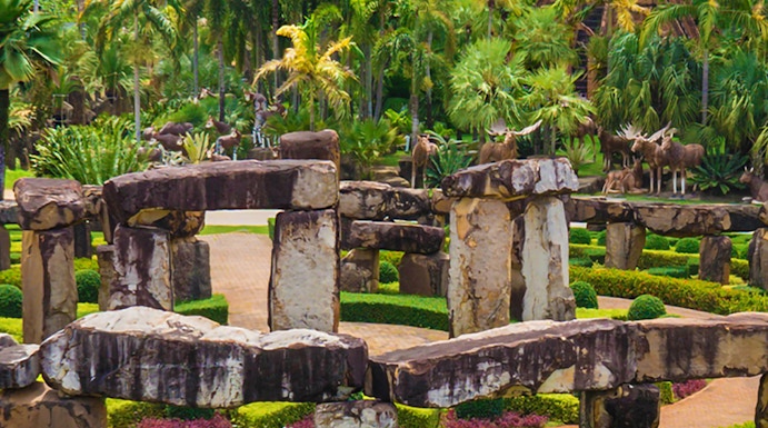 Nong Nooch Tropical Garden in Pattaya with stone structures and lush greenery.