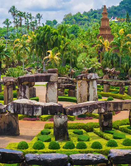 Nong Nooch Tropical Garden in Pattaya with stone structures and lush greenery.