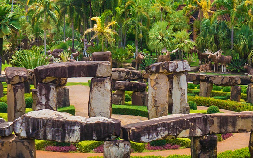 Nong Nooch Tropical Garden in Pattaya with stone structures and lush greenery.