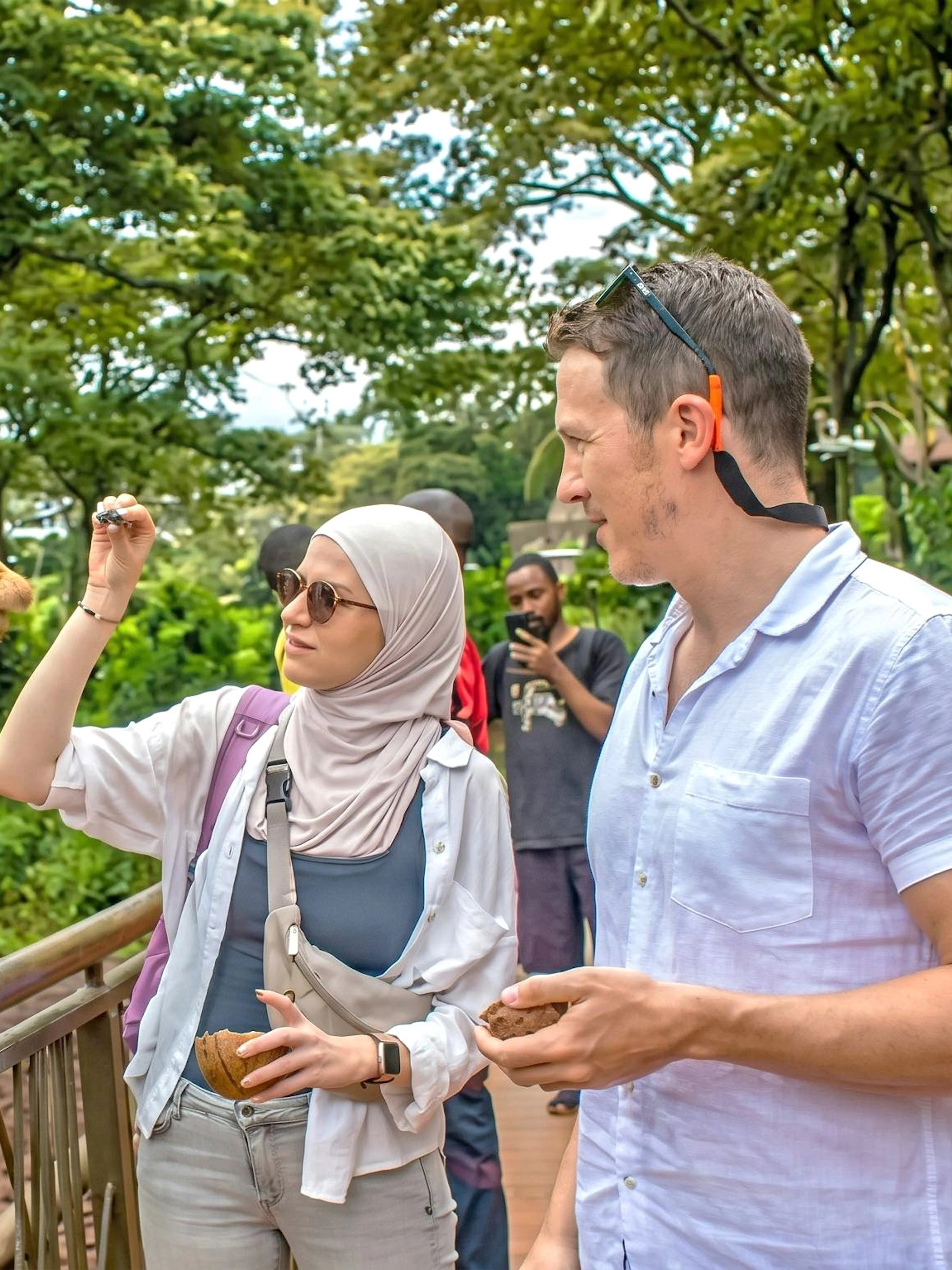 Couple feeding a giraffe at the Giraffe Centre in Nairobi.