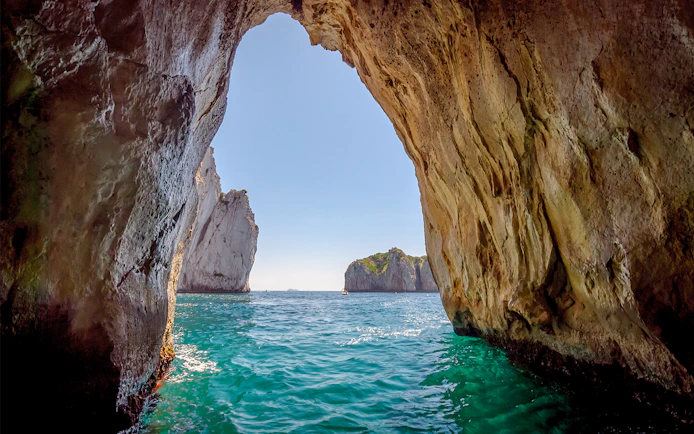 Capri Blue Grotto sea cave entrance with turquoise water in Italy.