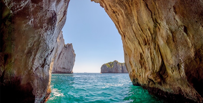 Capri Blue Grotto sea cave entrance with turquoise water in Italy.