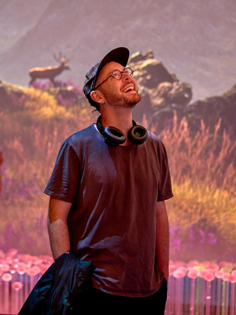 Visitors enjoying a sensory video journey through Scotland with scenic landscapes.