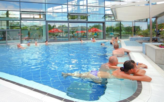 Visitors relaxing in the indoor pool at Paskal Thermal Bath, Budapest.