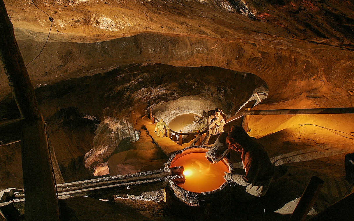 Wieliczka Salt Mine interior with sculptures and illuminated pathways, Krakow tour.