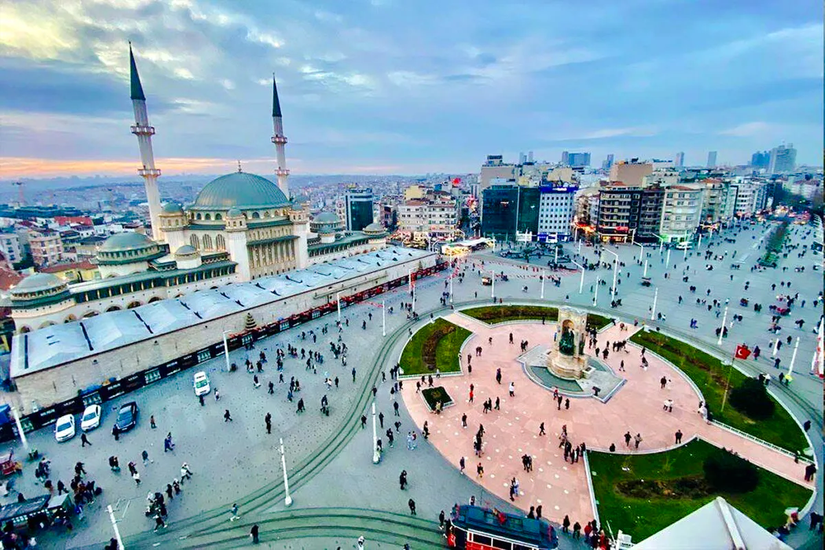 Taksim Square with Republic Monument and mosque, Istanbul, view from hop-on hop-off bus tour.