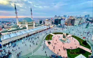 Taksim Square with Republic Monument and mosque, Istanbul, view from hop-on hop-off bus tour.