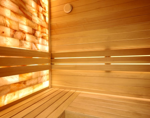 Mini sauna at Caldea Spa in Andorra with wooden interior and seating.