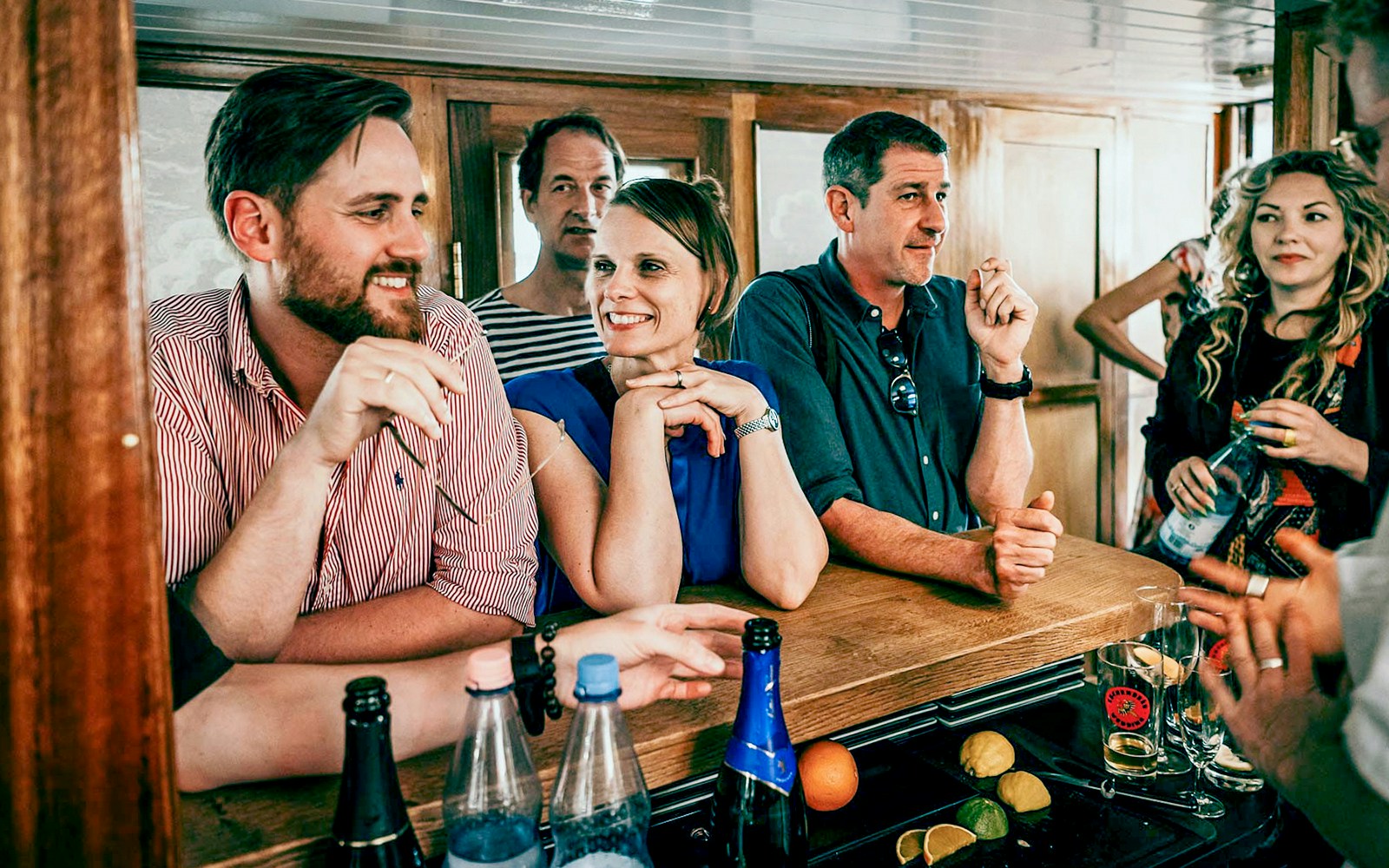  passengers enjoying a meal and a drink on the cruise