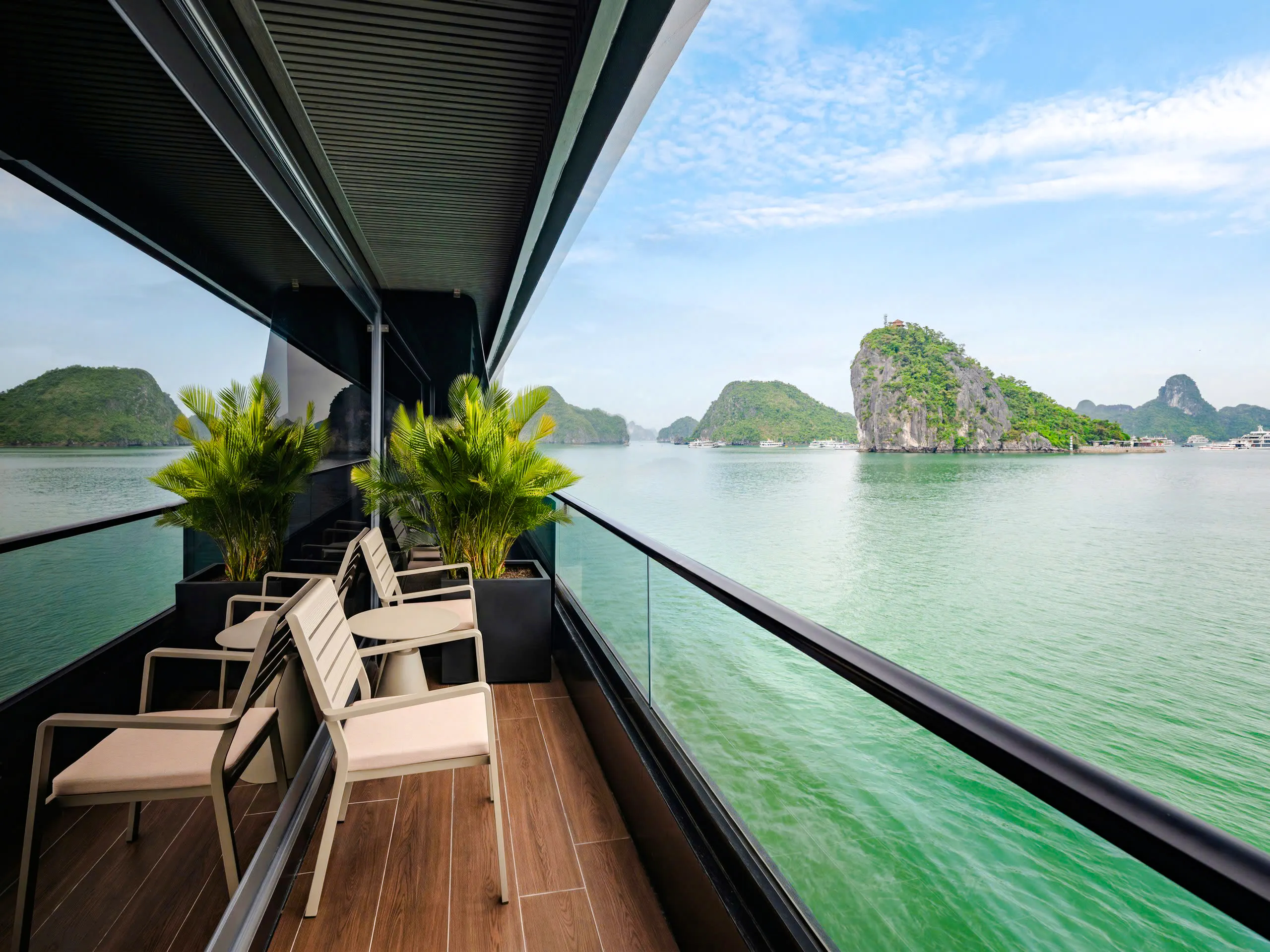 Cruise deck overlooking limestone islands in Halong Bay, Vietnam.