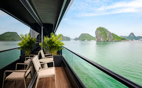 Cruise deck overlooking limestone islands in Halong Bay, Vietnam.