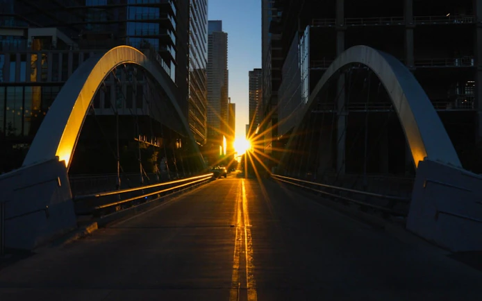 Sunset view between skyscrapers on a bridge in Austin, Texas.