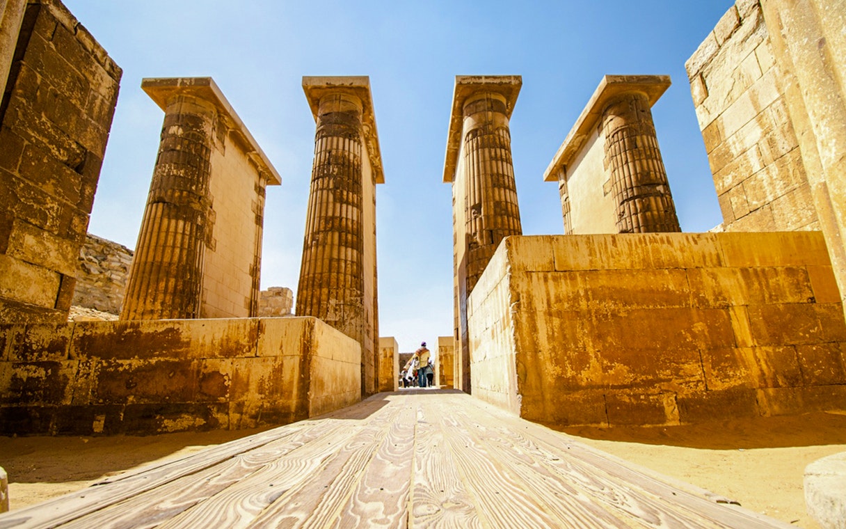 Ancient columns and stone walls inside Luxor Temple, Egypt.