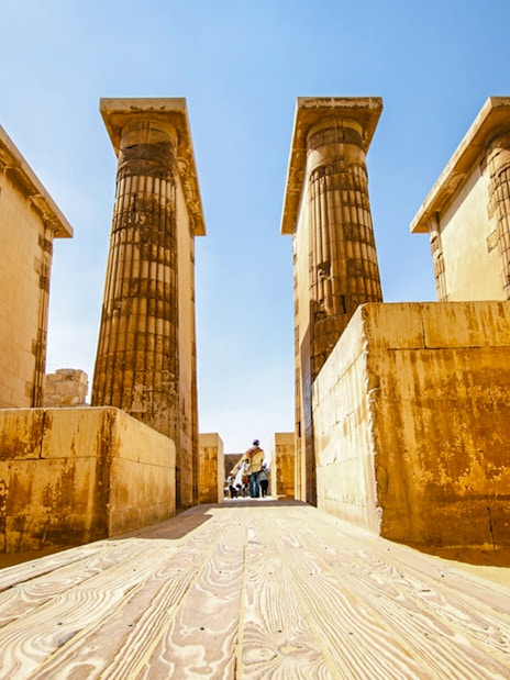 Ancient columns and stone walls inside Luxor Temple, Egypt.