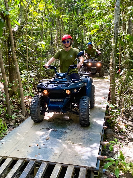 ATV riders navigating forest trail on Langkawi Sky ATV Ride, Mountain Manchinchang.