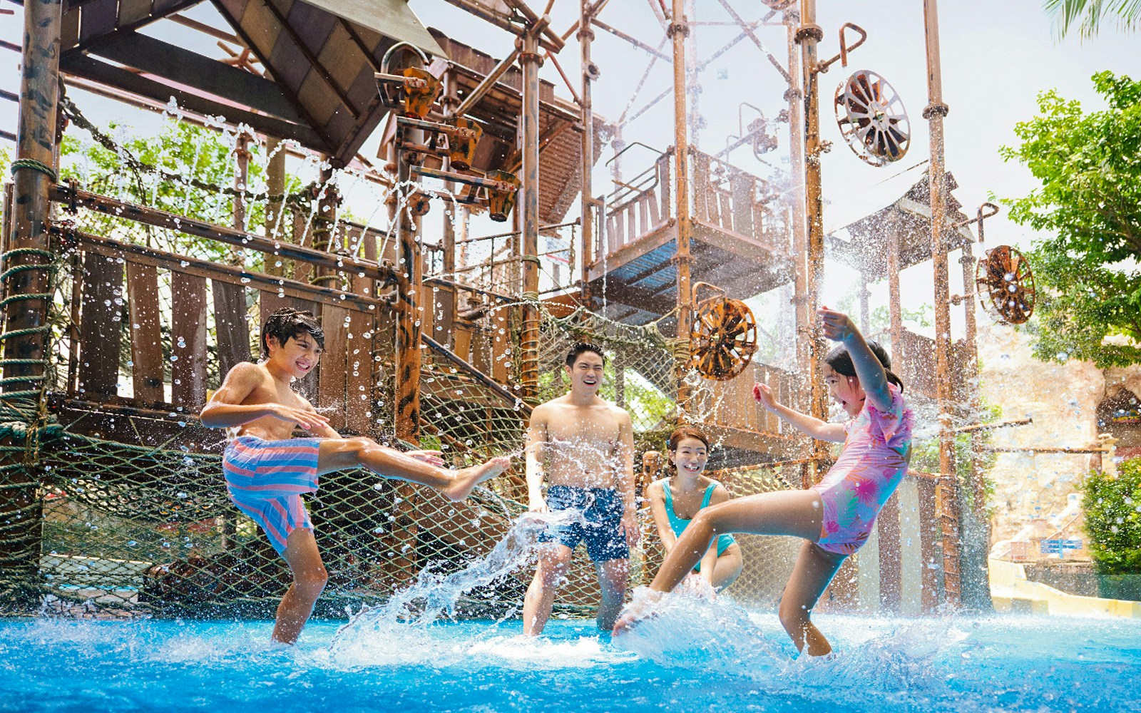 Visitors enjoying water play at Adventure Cove Waterpark™ with interactive structures.