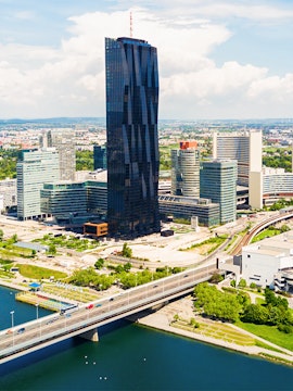 Aerial view of Danube district with skyscraper and bridge, Vienna.
