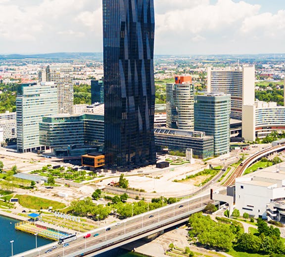 Aerial view of Danube district with skyscraper and bridge, Vienna.