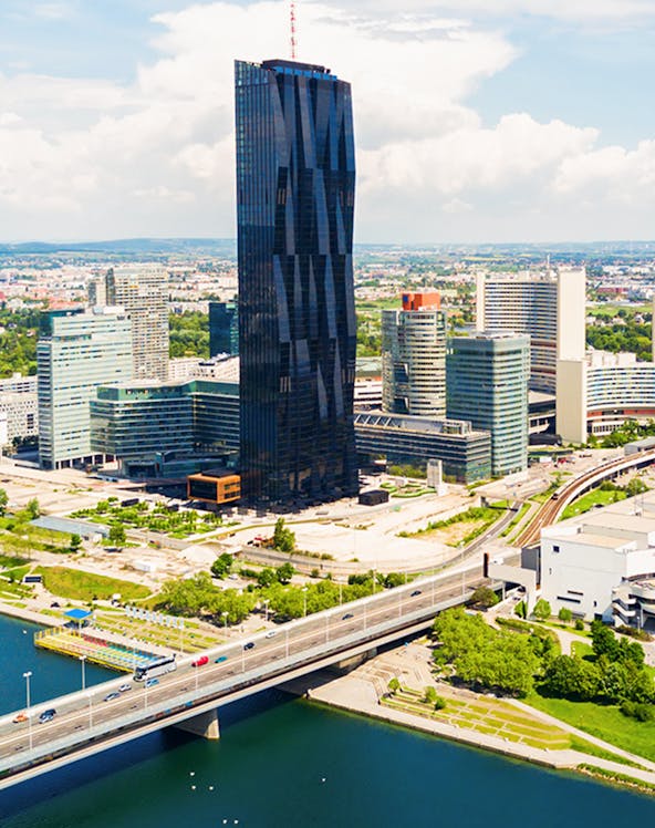 Aerial view of Danube district with skyscraper and bridge, Vienna.