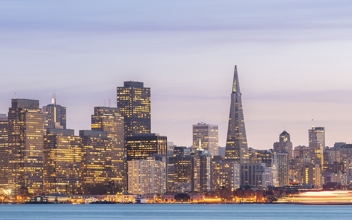 San Francisco skyline with Transamerica Pyramid at sunset during Big Bus tour.
