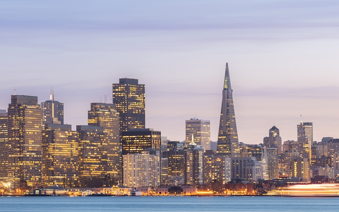 San Francisco skyline with Transamerica Pyramid at sunset during Big Bus tour.