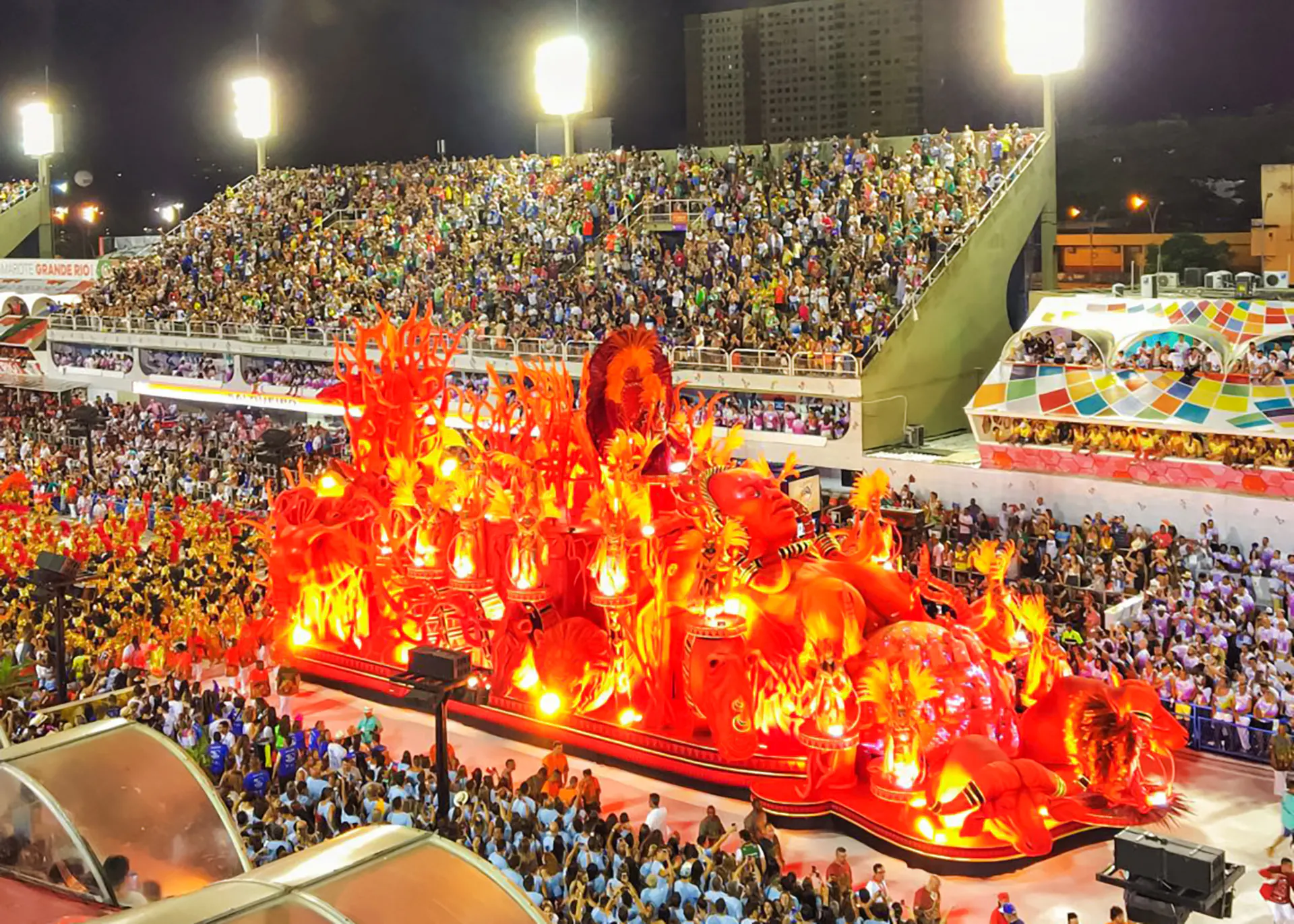 Parade float with vibrant red decorations at Rio Carnival, Marquês de Sapucaí, Rio de Janeiro.