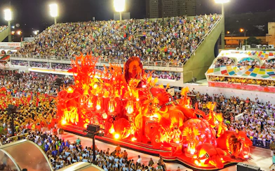 Parade float with vibrant red decorations at Rio Carnival, Marquês de Sapucaí, Rio de Janeiro.