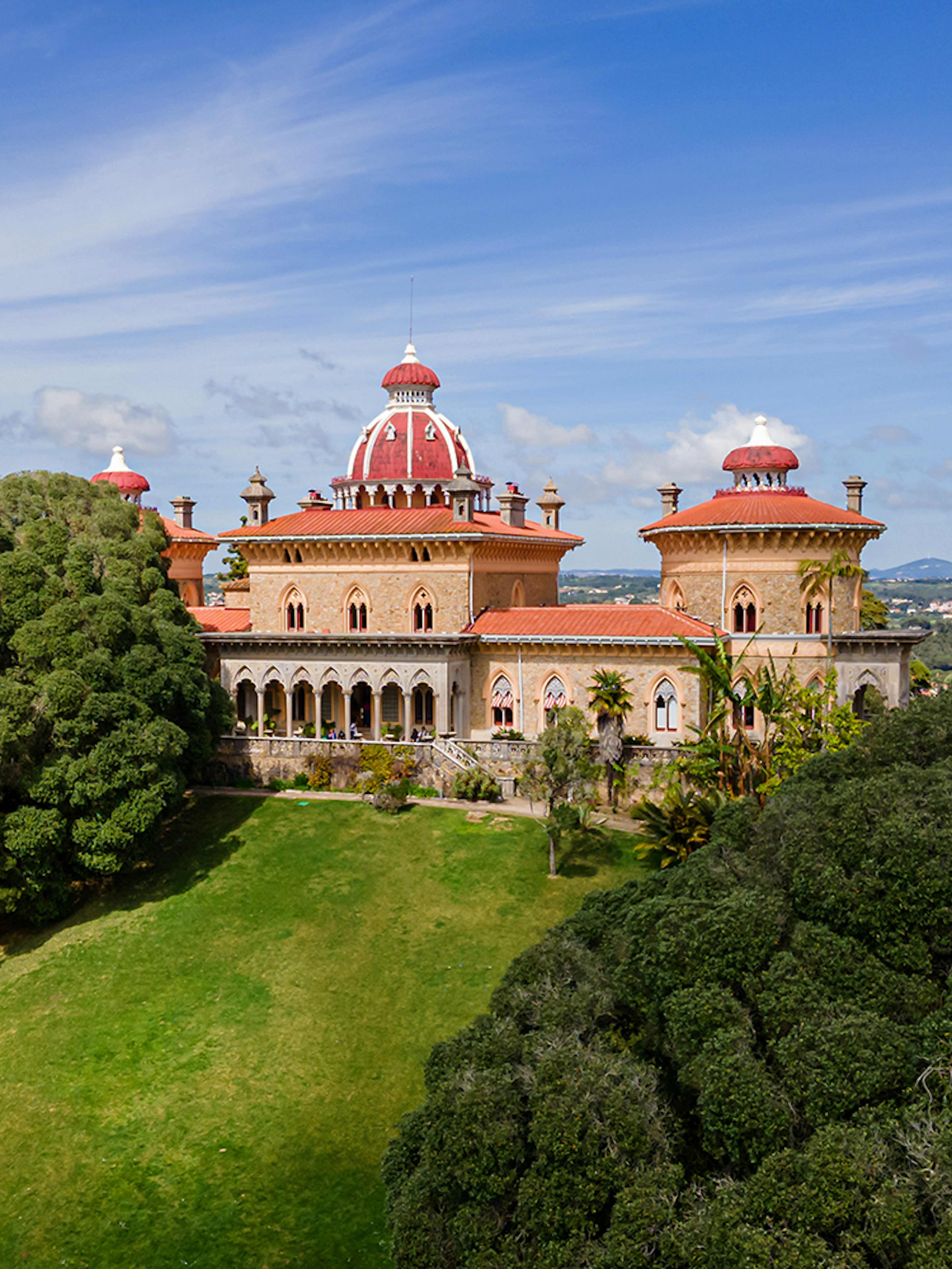 Monserrate Palace in Sintra surrounded by lush gardens and trees.