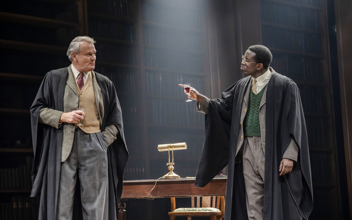 Stage performance of "Shadowlands" in West End with two actors in a library setting.