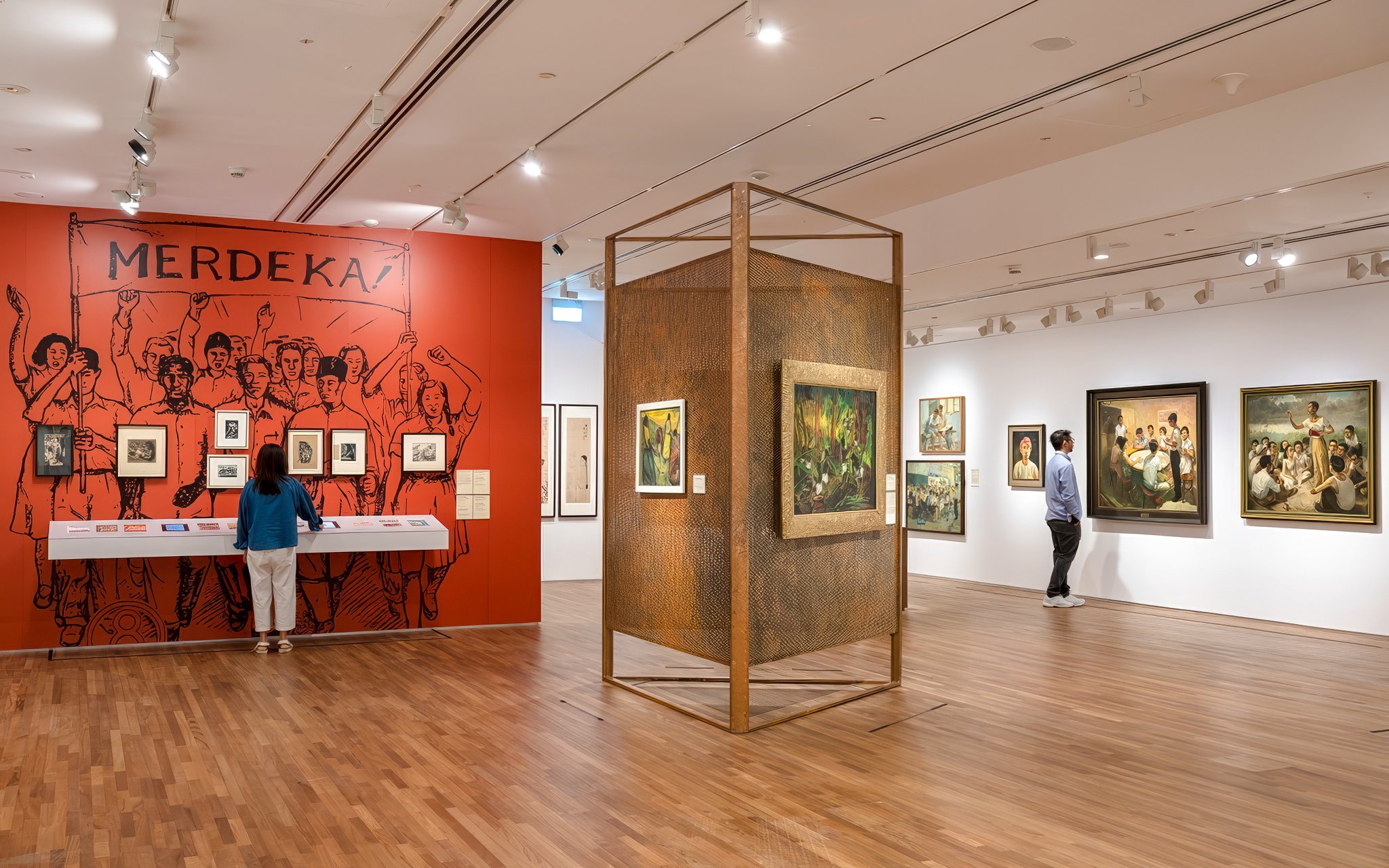 Interior of National Gallery Singapore showcasing modern art exhibits and visitors.