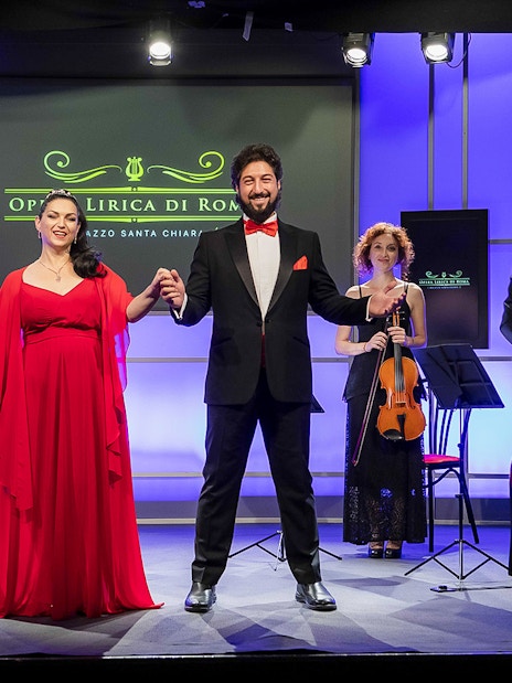 Opera singers and musicians on stage at Great Opera Arias Concert in Rome.