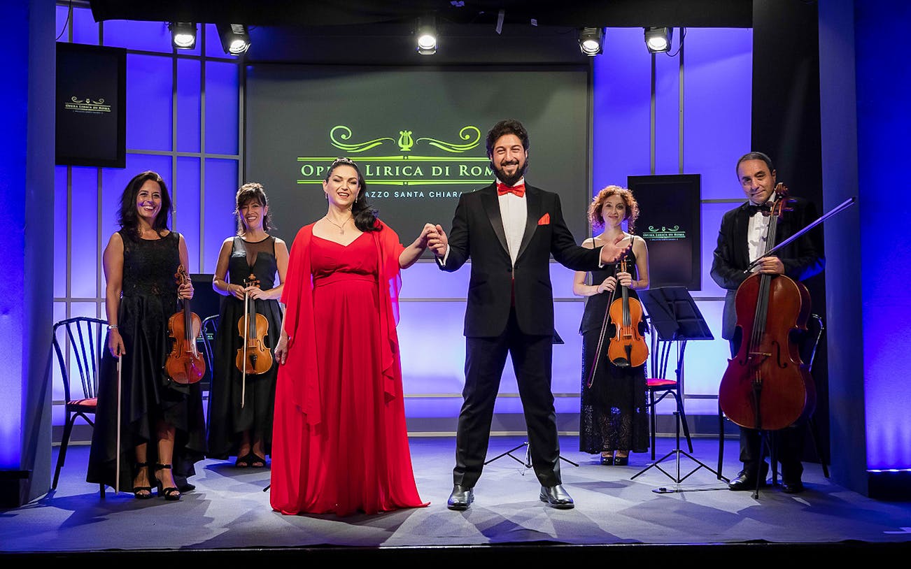 Opera singers and musicians on stage at Great Opera Arias Concert in Rome.