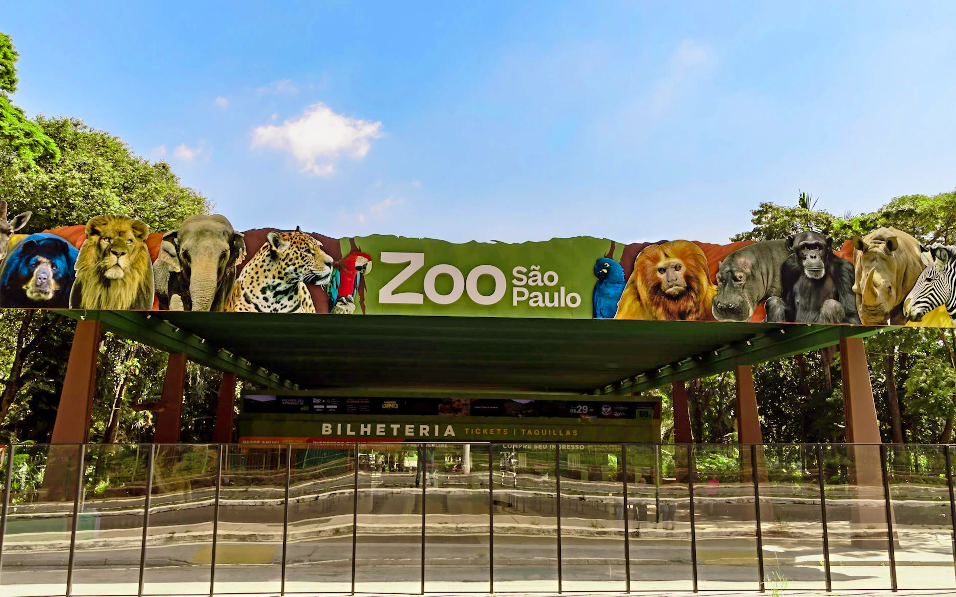 Entrance of São Paulo Zoo with animal images on the sign.