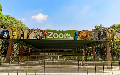 Entrance of São Paulo Zoo with animal images on the sign.